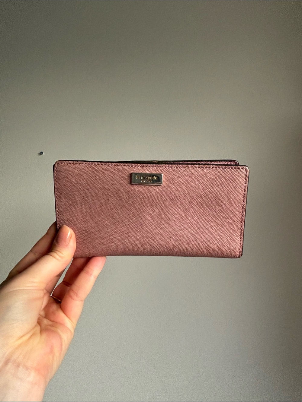 Kate Spade Laurel Way wallet in a soft pink peony color